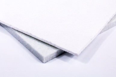 Two squares of white non-woven polyester felt, overlapping