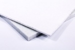 Two squares of white non-woven polyester felt, overlapping