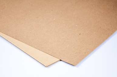 Two sheets of tan fiberboard, overlapping