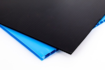 Black and blue squares of Fluted Polypropylene plastic, overlapping