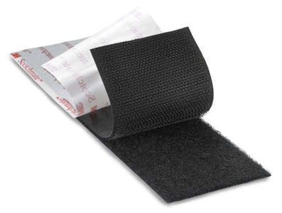 Black strip of Hook and Loop, unhooking and unpeeling