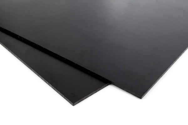 zoomed in corner of two sheets of black acetal