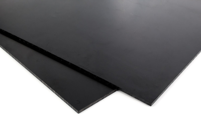 zoomed in corner of two sheets of black acetal