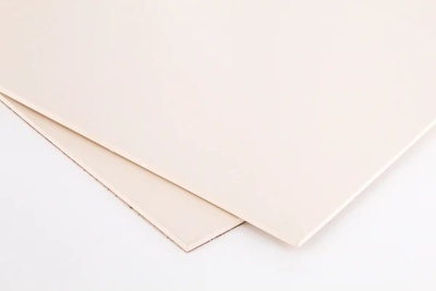 Two white squares of Nitrile (Buna-N), Food Grade rubber, overlapping