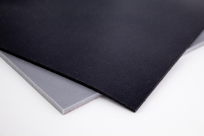 Two squares of black and gray Silicone Sponge, overlapping