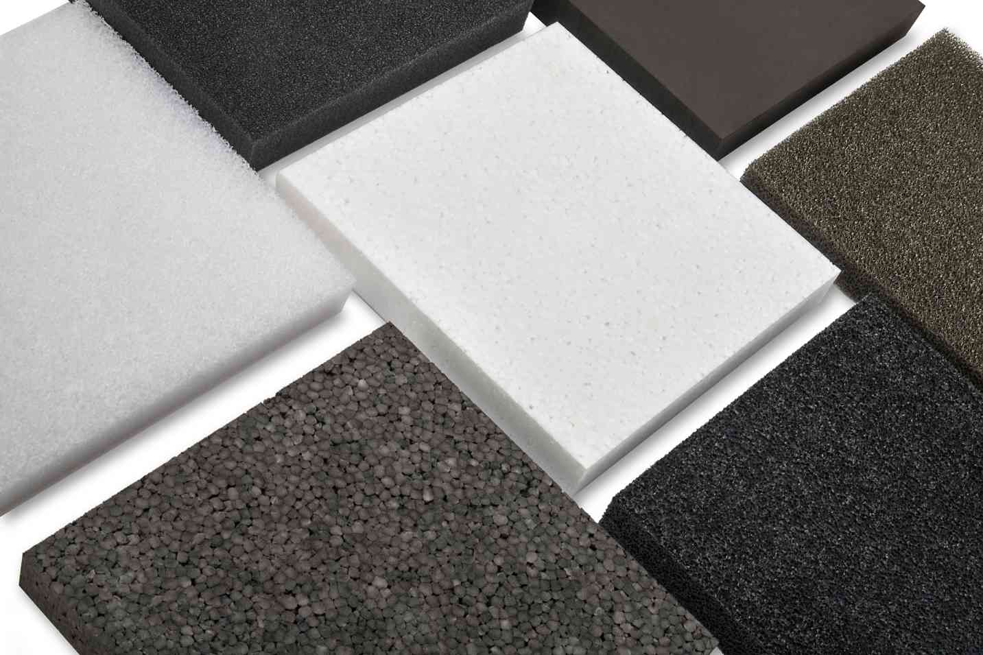 Squares of rubber in a variety of colors on white table